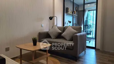 Modern living room with cozy sofa and stylish decor in a contemporary apartment.