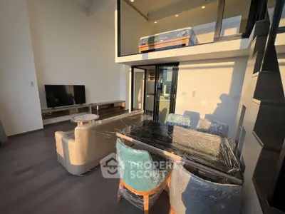 Modern duplex living room with stylish furniture and mezzanine level