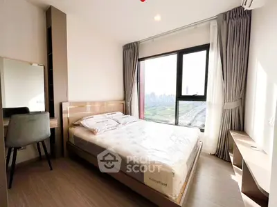 Modern bedroom with large window offering stunning city view, featuring sleek furniture and natural light.
