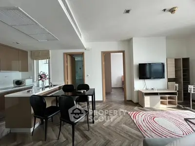 Modern open-plan living room with stylish kitchen and dining area