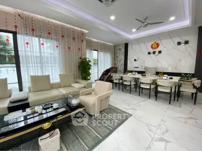 Luxurious modern living room with elegant dining area, marble flooring, and stylish decor.