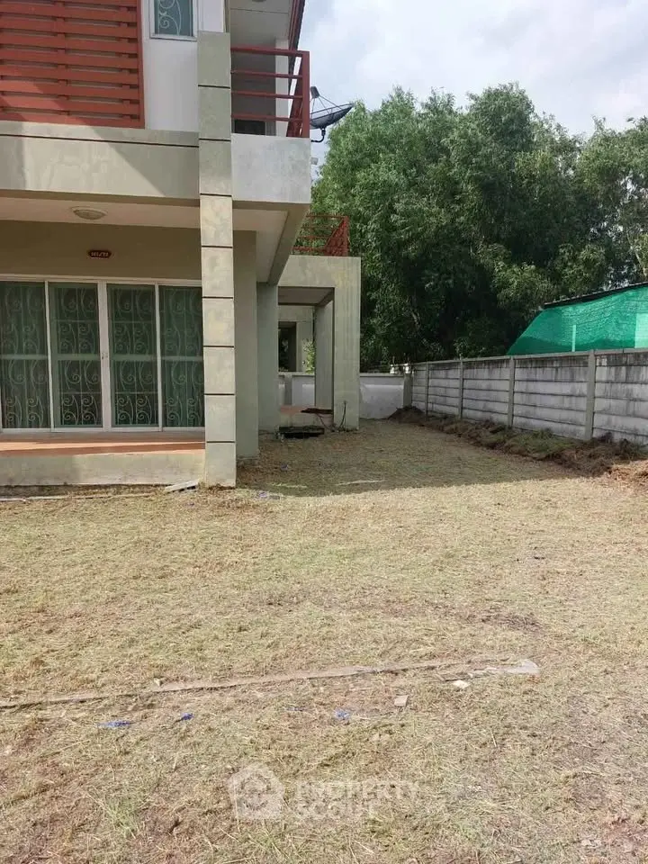 Spacious corner unit with private garden area and modern exterior design.