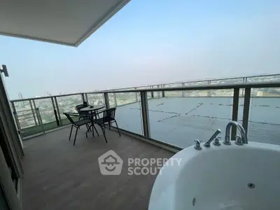 Luxurious balcony with stunning city view and outdoor bathtub