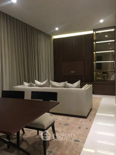 Luxurious modern living room with elegant sofa and dining area