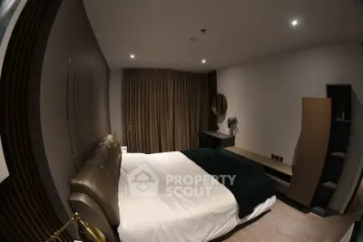 Luxurious modern bedroom with elegant decor and ambient lighting