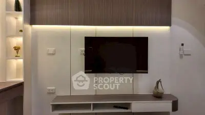 Modern living room with sleek TV unit and ambient lighting