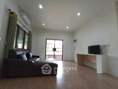 Spacious living room with modern decor and natural light
