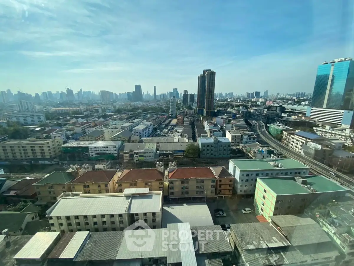 Stunning cityscape view from high-rise building showcasing urban skyline and vibrant neighborhood.