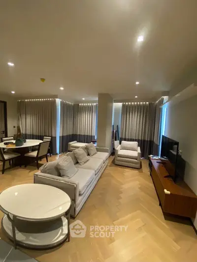 Spacious modern living room with elegant furniture and natural light