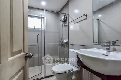 Modern bathroom with glass shower and sleek fixtures