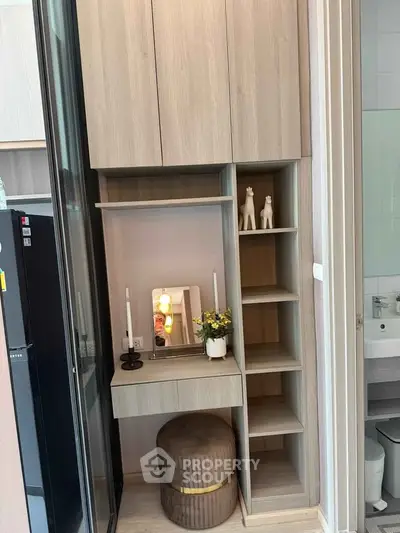 Modern apartment interior with stylish shelving and decor accents