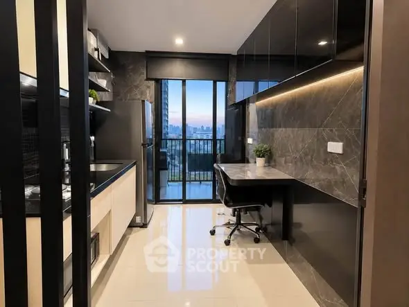 Modern kitchen with sleek design and city view from balcony