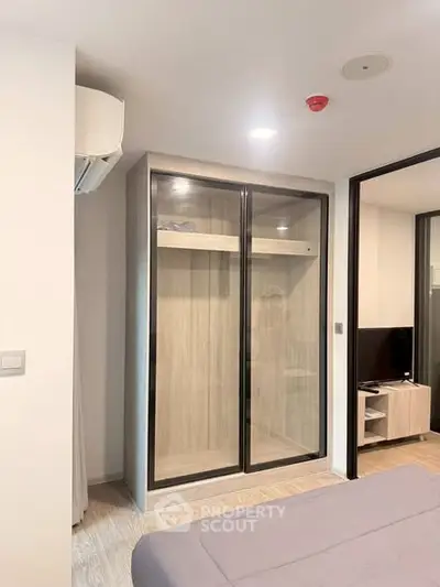 Modern bedroom with sleek built-in wardrobe and minimalist design