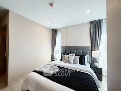 Elegant bedroom with modern decor and natural light