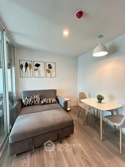 Modern living room with stylish decor and cozy seating area.