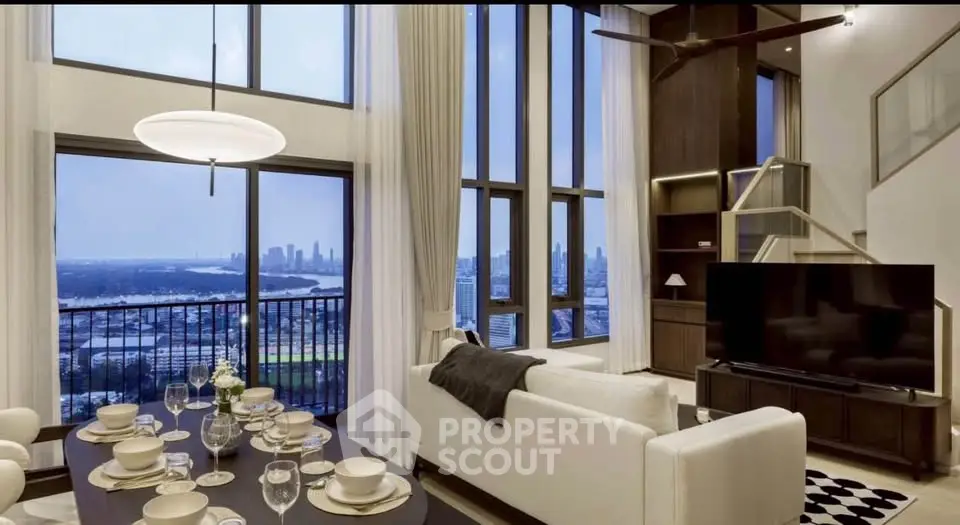 Luxurious high-rise living room with stunning city and ocean views, elegant dining setup, and modern decor.