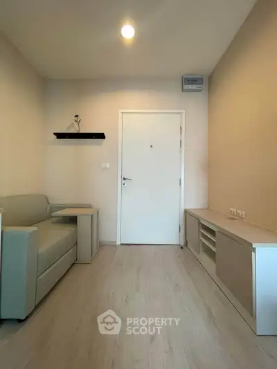 Modern minimalist living room with sleek furniture and neutral tones