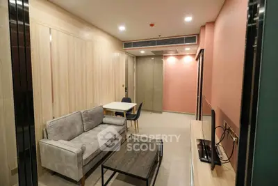 Modern living room with stylish furniture and warm lighting in a contemporary apartment.