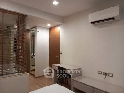 Modern bedroom with air conditioning and sleek wooden accents