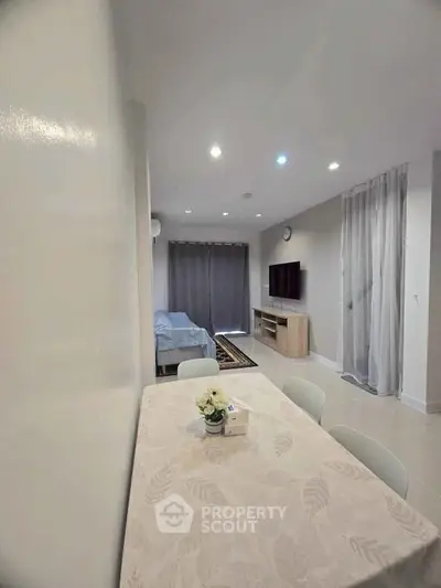 Modern living room with dining area and stylish decor