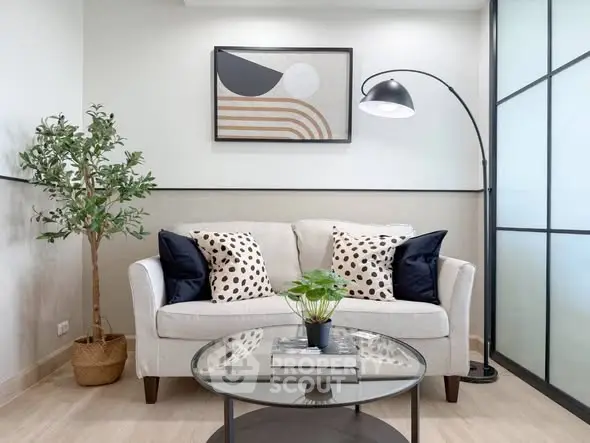 Stylish modern living room with cozy sofa, elegant decor, and chic lighting, perfect for relaxation and entertaining.
