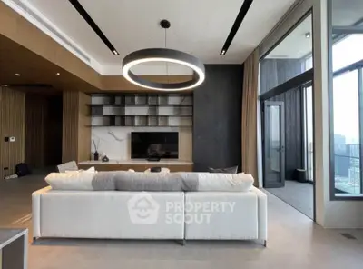 Luxurious modern living room with elegant lighting and spacious balcony view