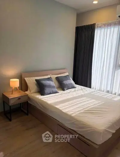 Cozy bedroom with modern decor and natural light