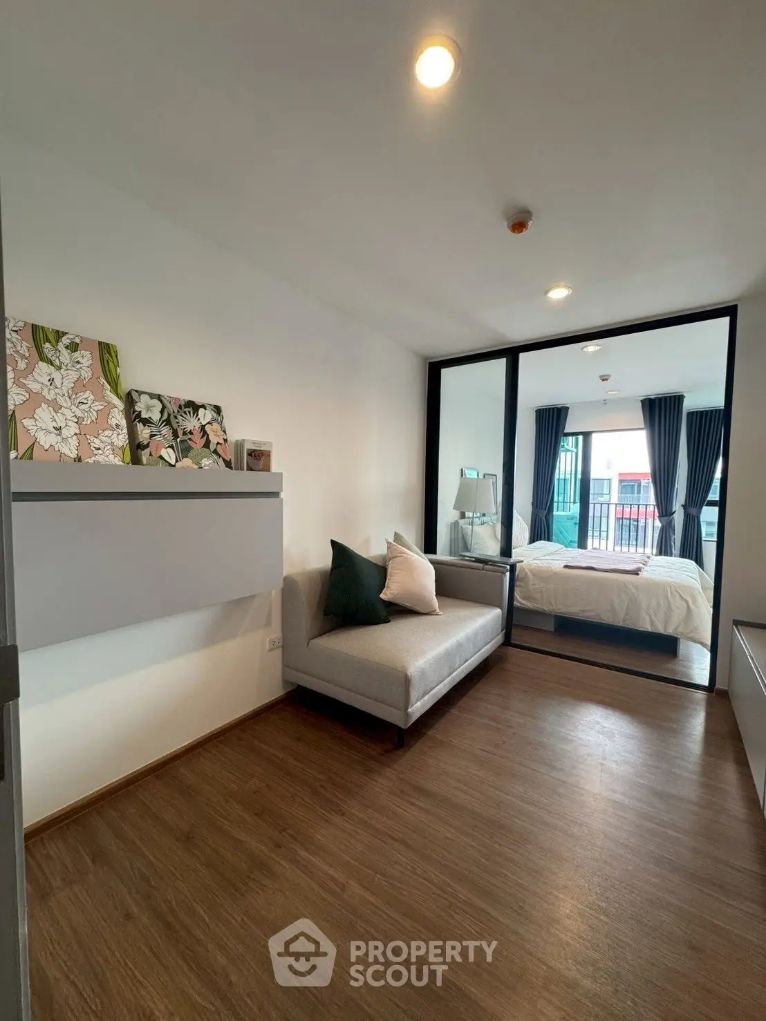 Modern studio apartment with cozy living area and stylish bedroom