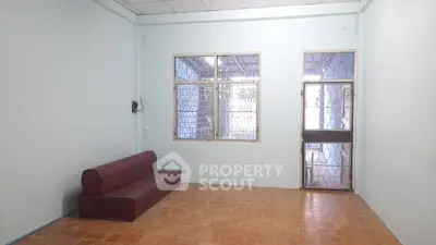 Spacious living room with minimalist design and tiled flooring