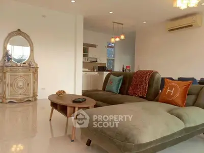 Spacious living room with elegant decor and modern furniture in a stylish apartment.