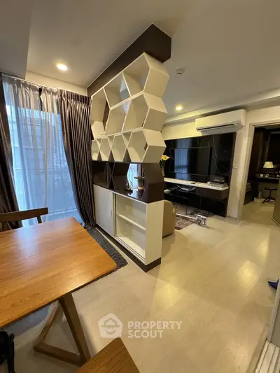 Modern living room with unique geometric shelving and stylish decor