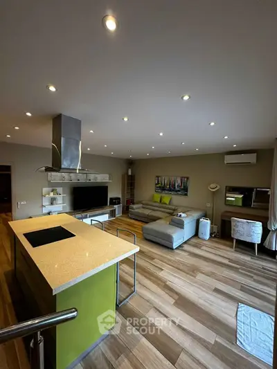 Spacious modern living room with open kitchen and stylish decor