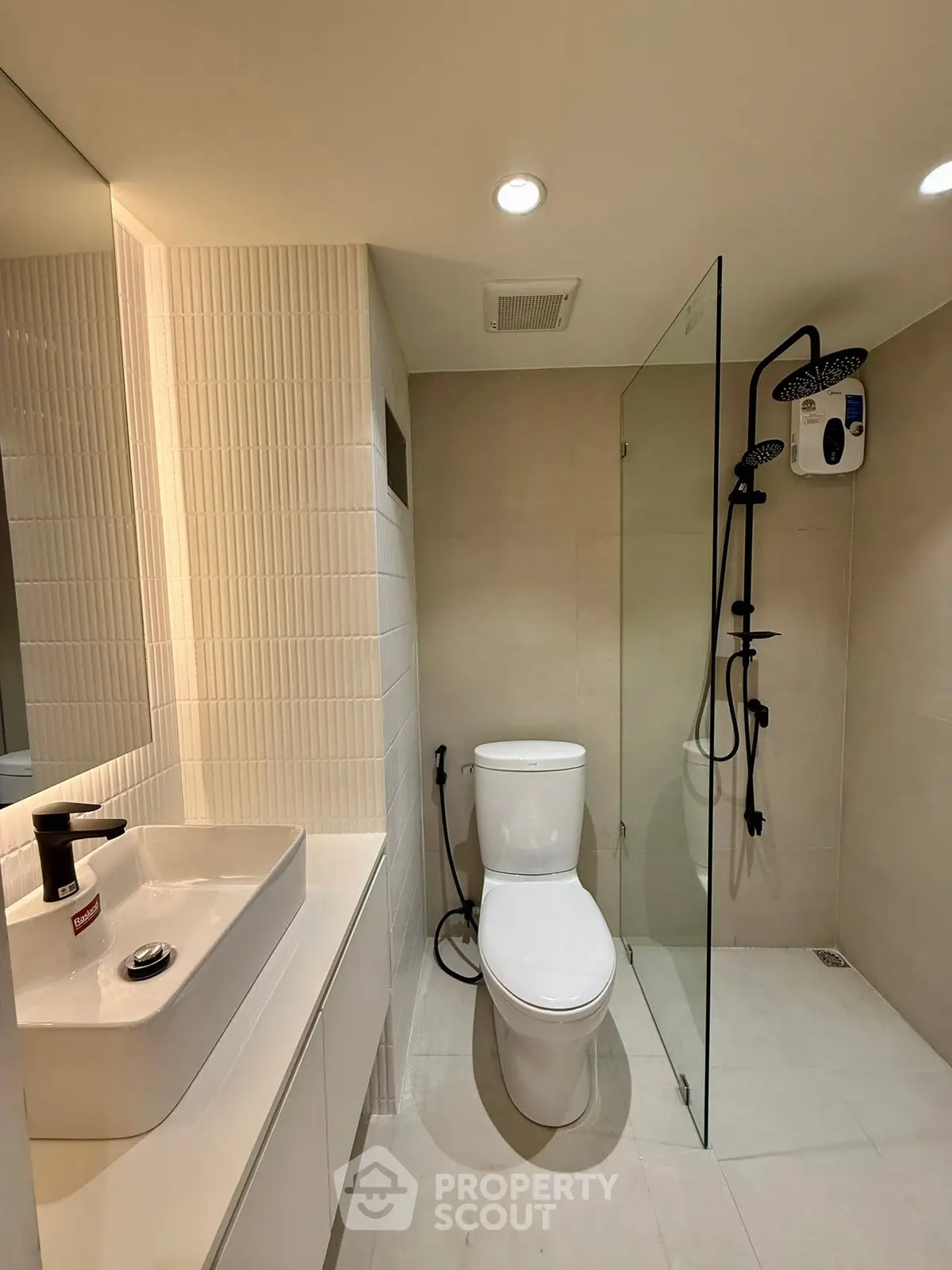 Modern bathroom with sleek fixtures and glass shower enclosure