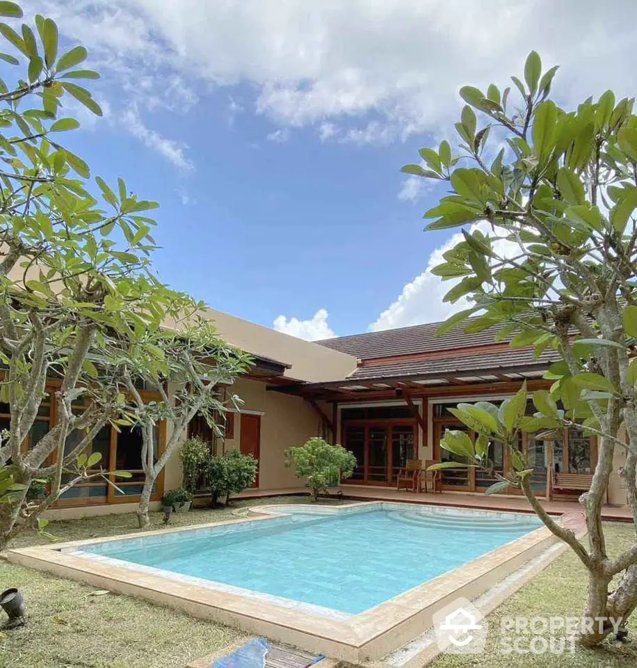 Stunning villa with private pool and lush garden, perfect for luxurious living.