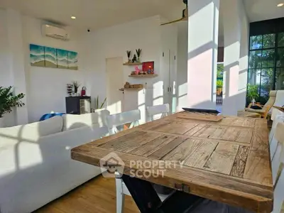 Bright and airy living room with rustic wooden table and modern decor