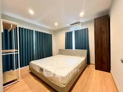 Spacious bedroom with modern design and natural light