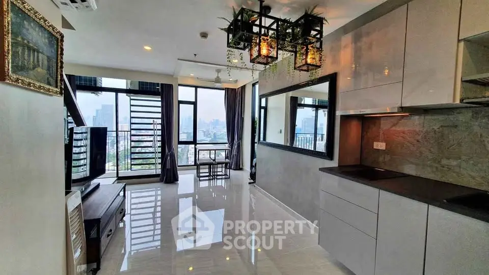 Modern open-plan living room with city view, sleek kitchen, and stylish decor in high-rise apartment.