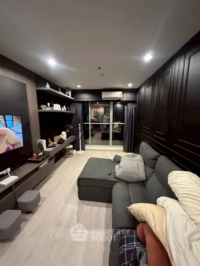 Stylish living room with modern decor and cozy seating area, perfect for relaxation and entertainment.