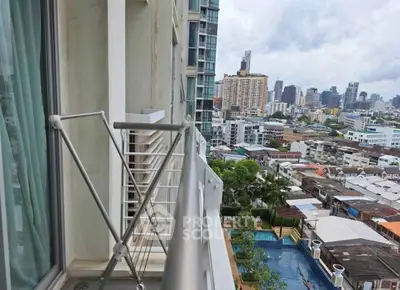 High-rise balcony with cityscape view, perfect for urban living enthusiasts.