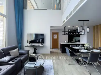Luxurious modern living room with high ceilings and open kitchen layout