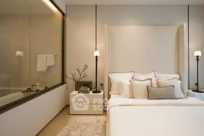 Luxurious bedroom with elegant decor and soft lighting, featuring a cozy bed and stylish bedside lamps.