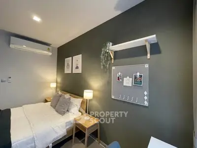 Cozy bedroom with modern decor and wall-mounted air conditioner
