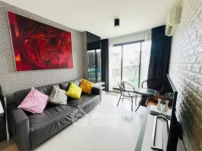 Modern living room with stylish decor and large windows offering city views.