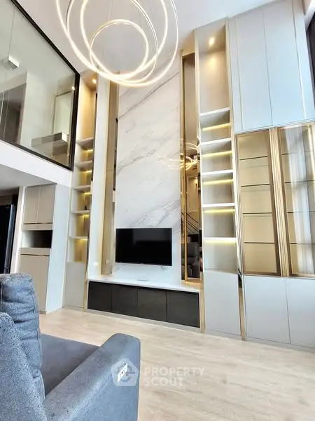 Luxurious modern living room with high ceilings and elegant lighting