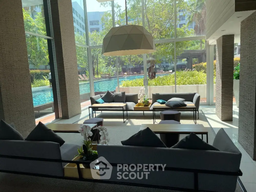 Luxurious modern living room with pool view and elegant decor