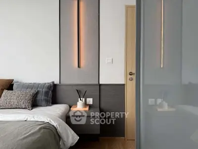 Modern bedroom with stylish lighting and cozy decor