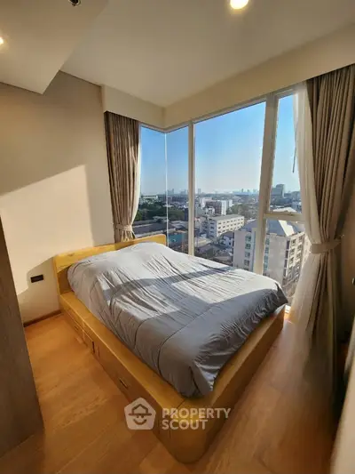 Luxurious bedroom with panoramic city view and modern design