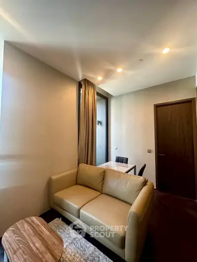 Modern living room with cozy sofa and dining area in elegant apartment