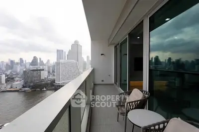 Stunning high-rise balcony with breathtaking city and river views, perfect for urban living.