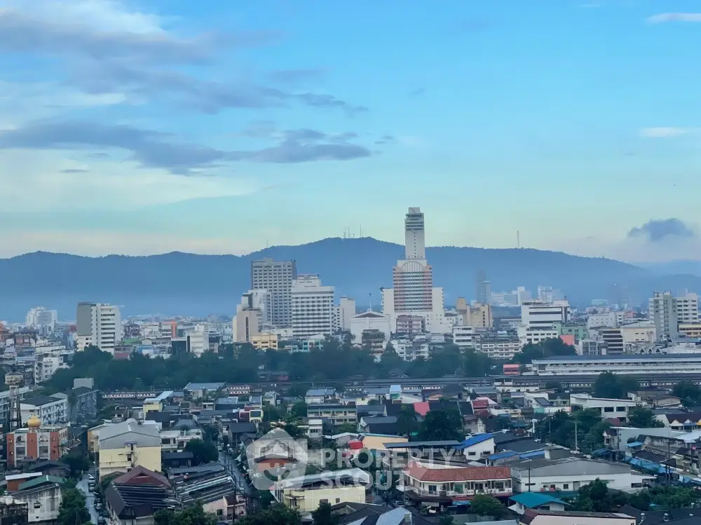 Stunning cityscape view with mountains and skyline, perfect for urban living enthusiasts.